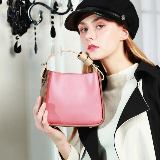 A stylish microfibre leather tote bag with a chic bucket shape and ruched detailing, perfect for the modern British woman.
