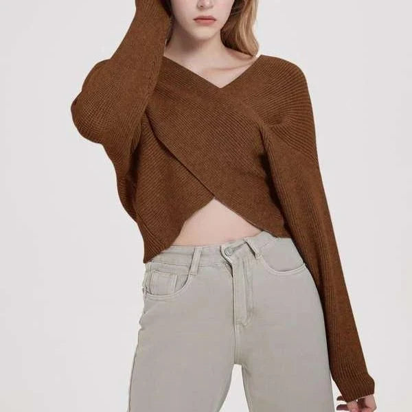 A cosy, brown V-neck knitted jumper with a relaxed, comfortable fit and a touch of vintage-inspired style.
