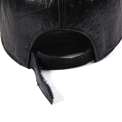 A stylish men's baseball cap made from warm, first-layer cowhide leather with an eye-catching ostrich pattern design.