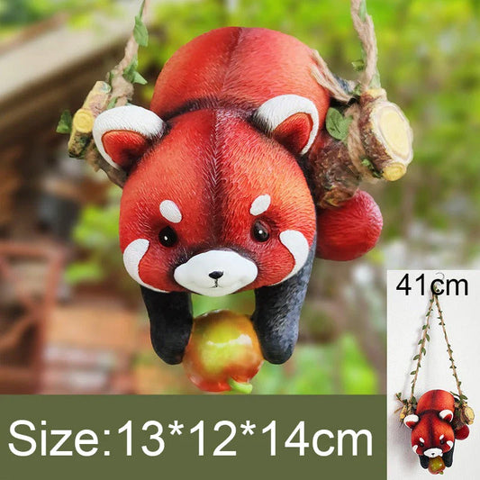 Charming resin raccoon statue climbing a decorative rope, adding a whimsical and nature-inspired touch to your outdoor or indoor spaces