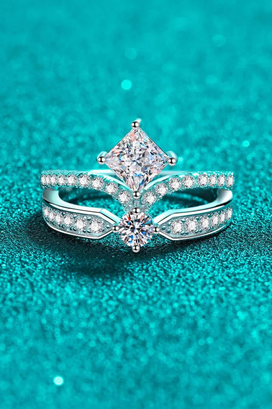 Elegant sterling silver ring with a moissanite centre stone and zircon accents, featuring a modern and minimalist crown design