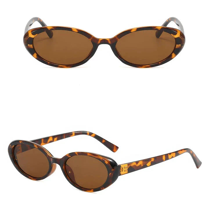 Oval-shaped women's sunglasses in a white and grey colour, offering UV protection and a stylish, retro-inspired design.