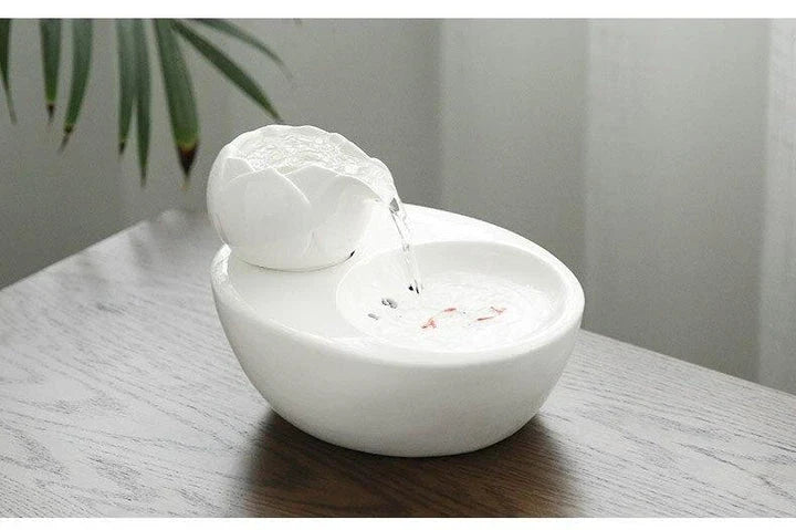 Elegant British-inspired ceramic drinking fountain with adjustable water flow and soothing ambiance