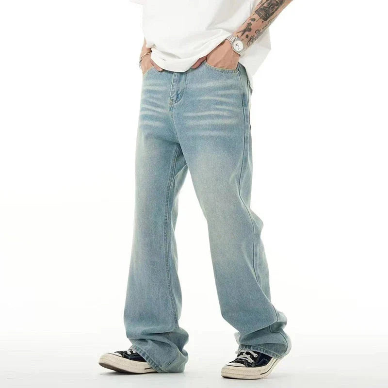 Premium light blue washed relaxed fit jeans with subtle fading and distressing, made from high-quality cotton for exceptional comfort and durability.