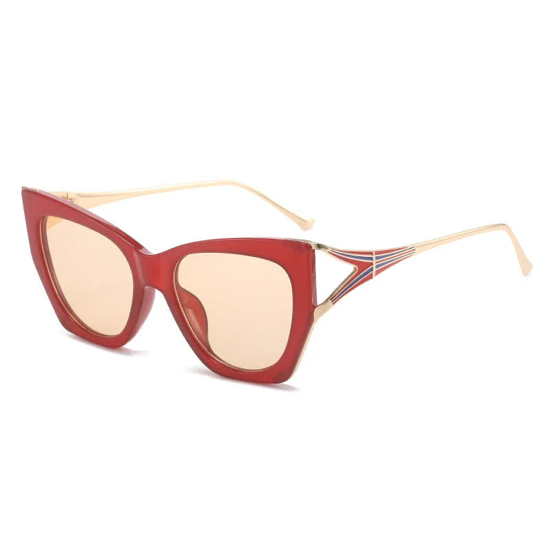 Refined cat eye sunglasses with blue gradient lenses and sleek metal frames, offering timeless British style and UV400 protection.