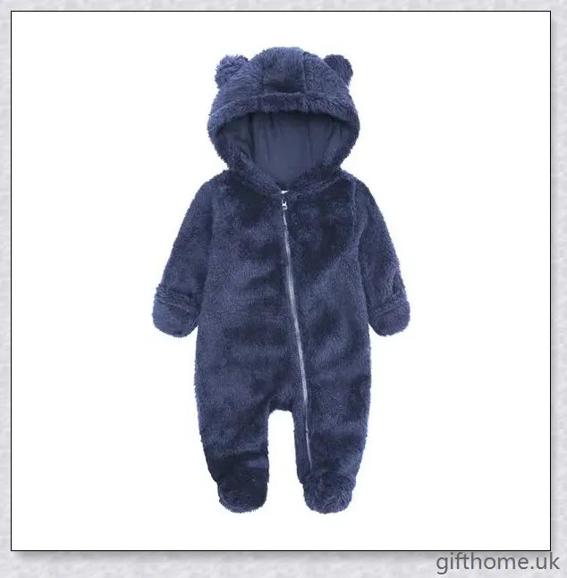 Adorable baby wearing a cosy hooded jumpsuit in blue, pink, or apricot colour