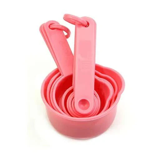 A set of 10 pink baking measurement cups and spoons made from food-grade plastic for precise ingredient measurements
