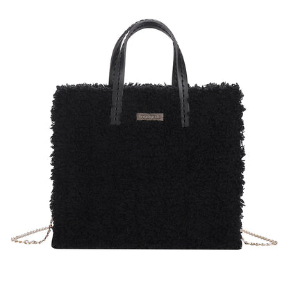 A premium hand-woven tote bag in a stylish design, featuring a magnetic closure and an adjustable shoulder strap for versatile use.
