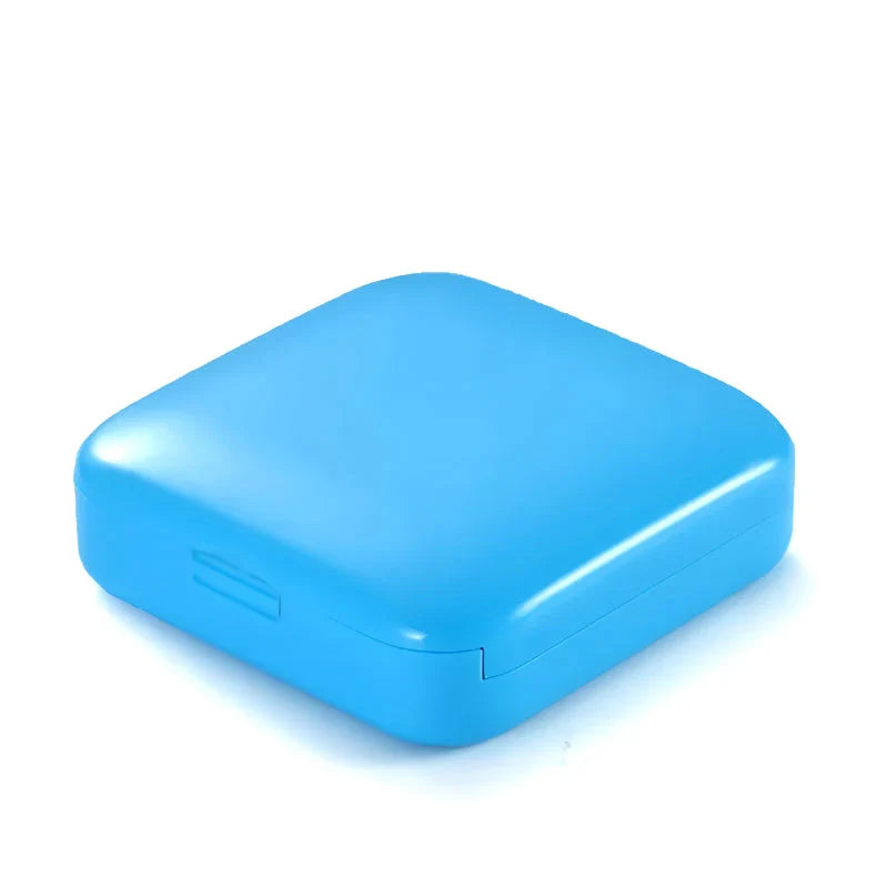 Compact push-pull pill case organiser in various vibrant cartoon-inspired colours for convenient medication management