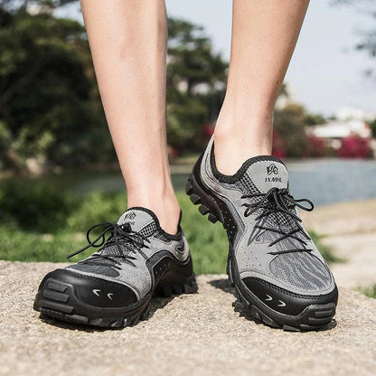 Couple wearing durable British-made mesh hiking shoes exploring the outdoors