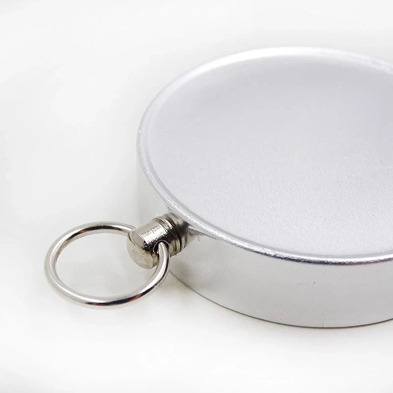 Compact aluminium compass keychain with tempered glass surface and bright compass face, perfect for outdoor adventures in the UK