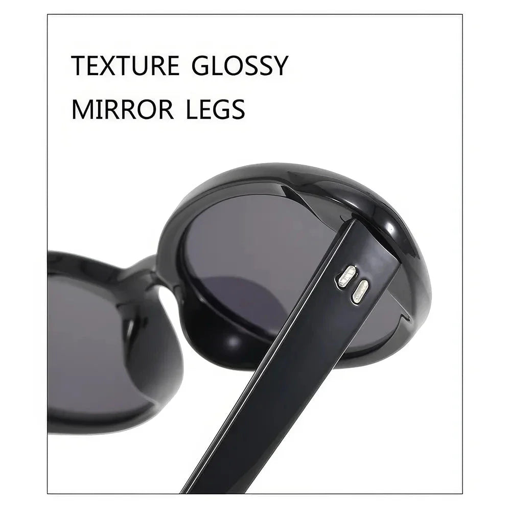 Oval-shaped women's sunglasses in a white and grey colour, offering UV protection and a stylish, retro-inspired design.