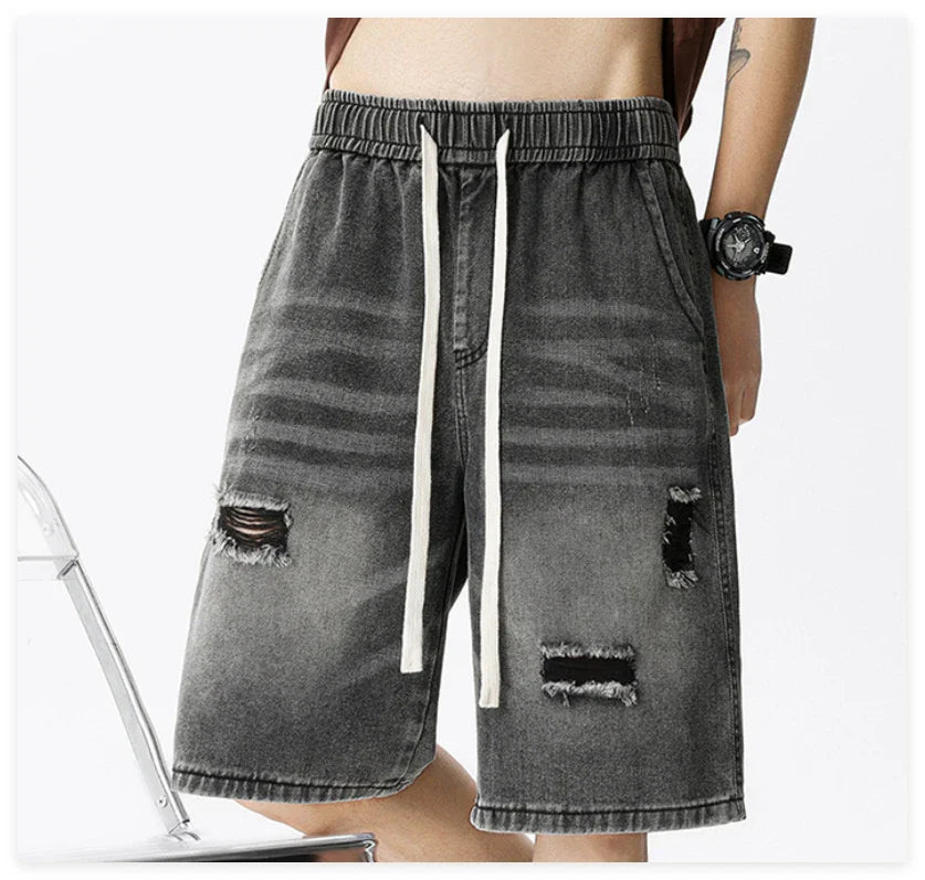 Premium British-crafted vintage-inspired ripped denim shorts for men with a straight-leg silhouette and authentic distressed details