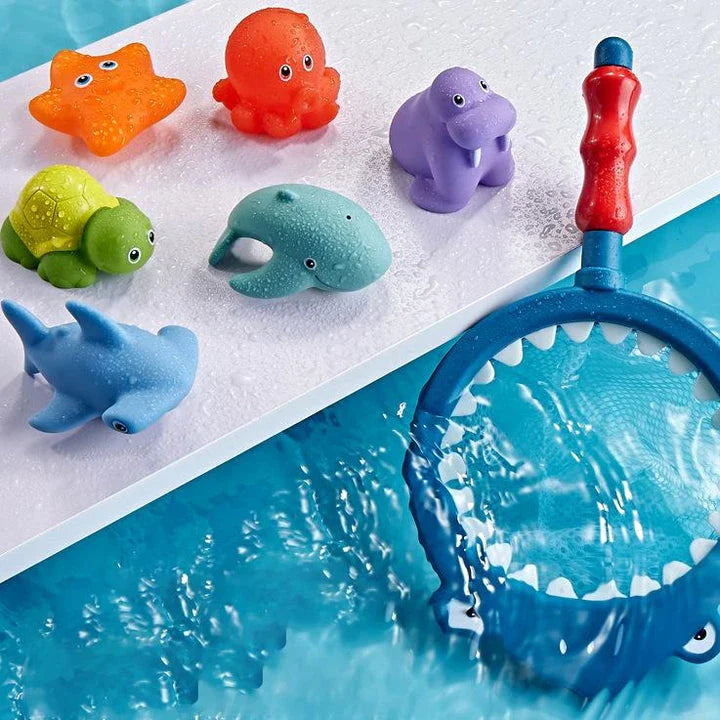 A set of colourful, floating bath toys including a fishing pole and net for interactive play
