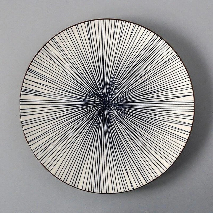 Elegant ceramic plates with vibrant, whimsical prints in a variety of enchanting designs
