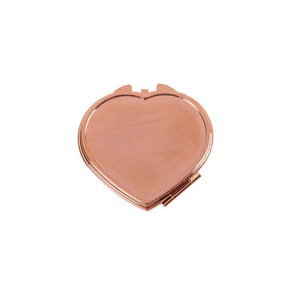 Elegant heart-shaped metal pill box with mirror for organized storage and convenient touch-ups