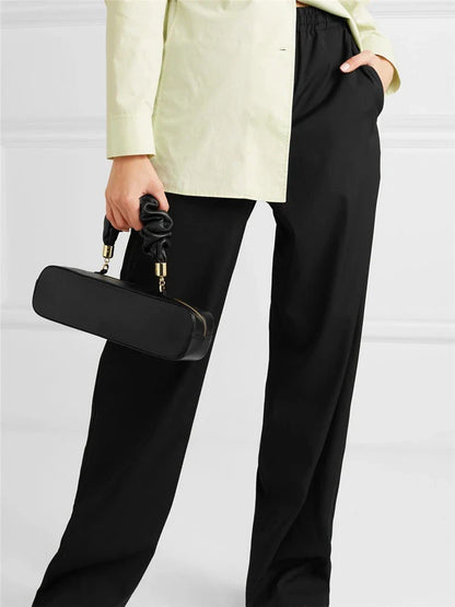 Sophisticated long shoulder diagonal bag with a sleek horizontal square design, made of durable synthetic leather and featuring a single shoulder strap for hands-free convenience.