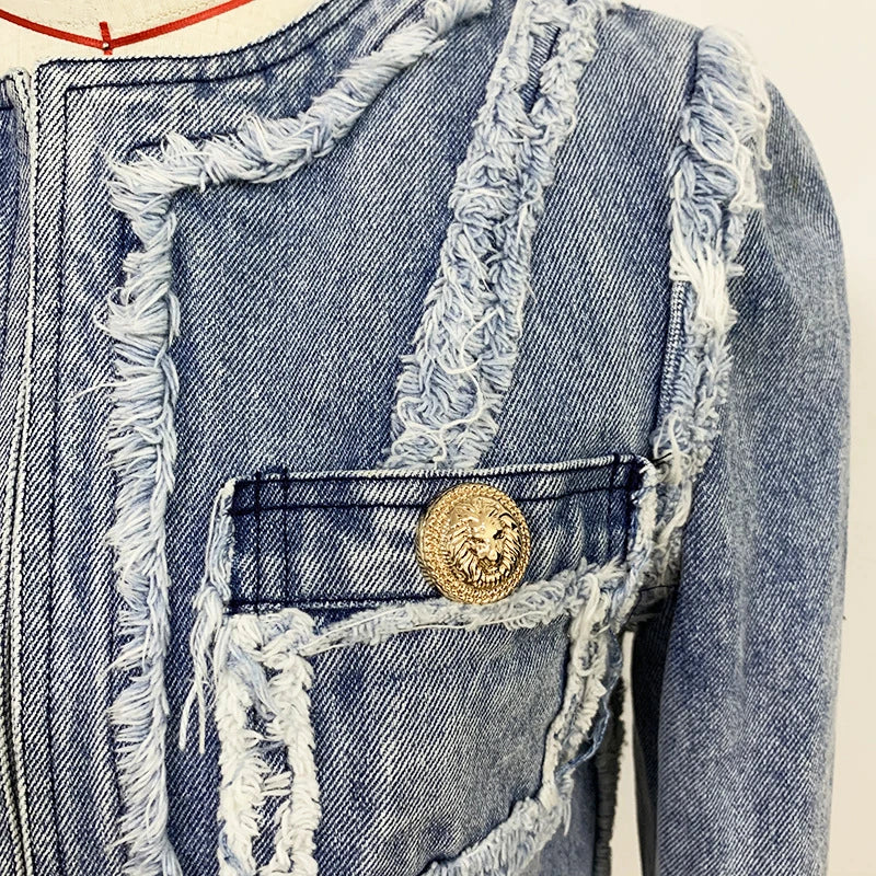 Trendha denim jacket with fringe stitching, lion head buckle, and slim-fit silhouette