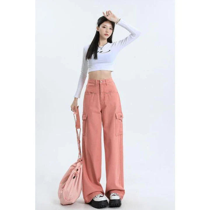 A pair of pink high-waist baggy jeans with a straight-leg design, featuring vintage-inspired details like buttons and faux zippers.