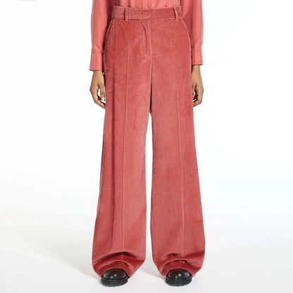 A pair of high-waist, wide-leg corduroy trousers in a classic red colour, designed for the modern British woman's wardrobe.