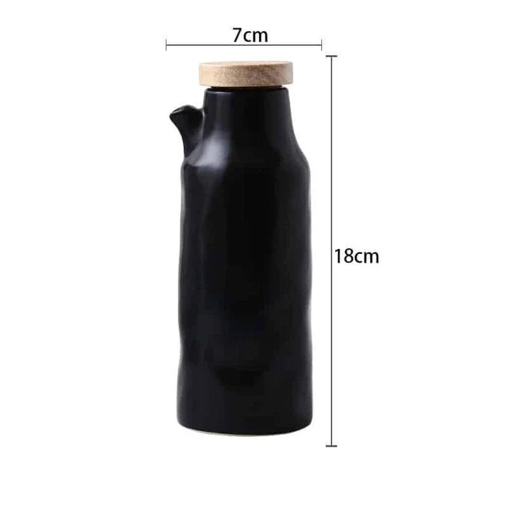 Premium black ceramic oil dispenser with a sleek and modern design, perfect for drizzling oils, vinegars, and sauces in the kitchen.