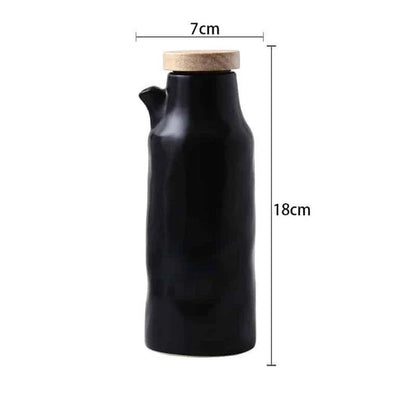 Premium black ceramic oil dispenser with a sleek and modern design, perfect for drizzling oils, vinegars, and sauces in the kitchen.