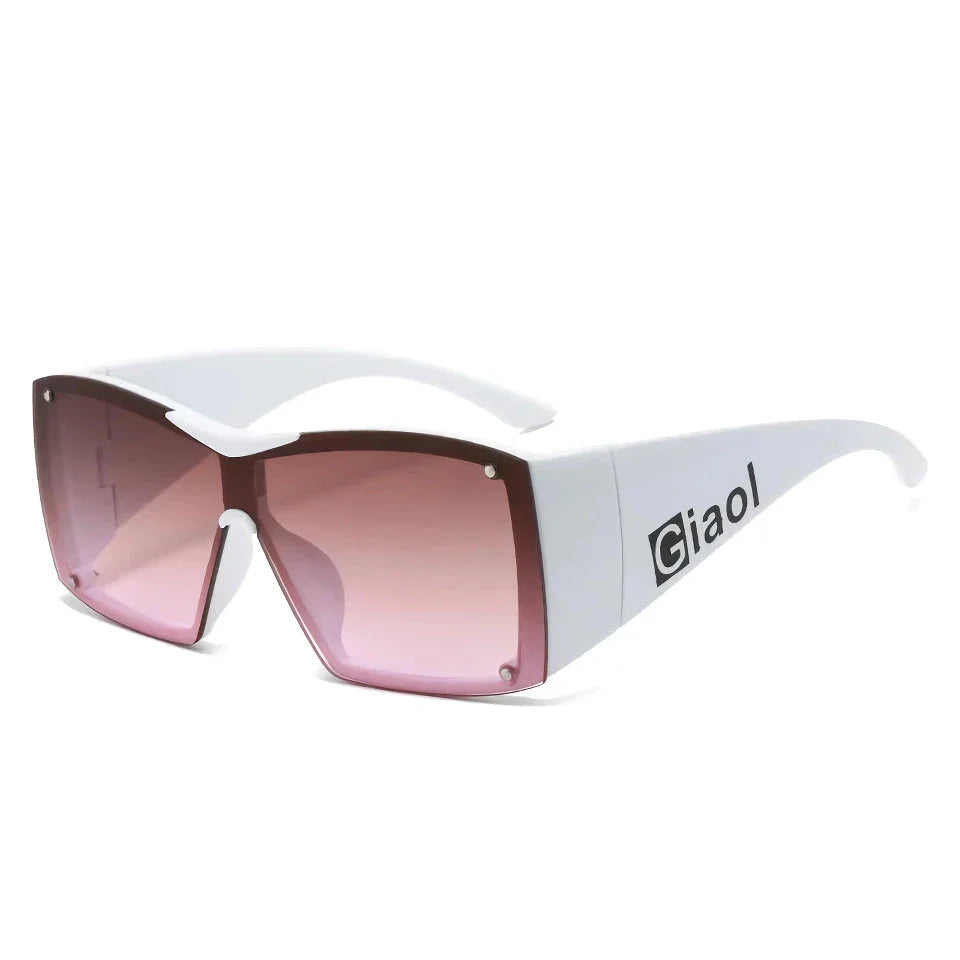 Oversized square sunglasses with black lenses and a durable plastic frame, offering UV400 protection and adaptive photochromic technology.