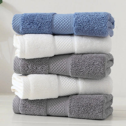 Premium 100% cotton face towel in blue, featuring a soft and absorbent design for daily facial cleansing and bathing