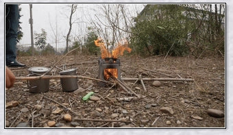 Compact titanium wood-burning camping stove with a folding design and carrying case for easy transport and storage