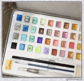 A set of vibrant watercolour paints with a glittering, iridescent effect, including brushes, a palette, and paper for a complete painting experience.