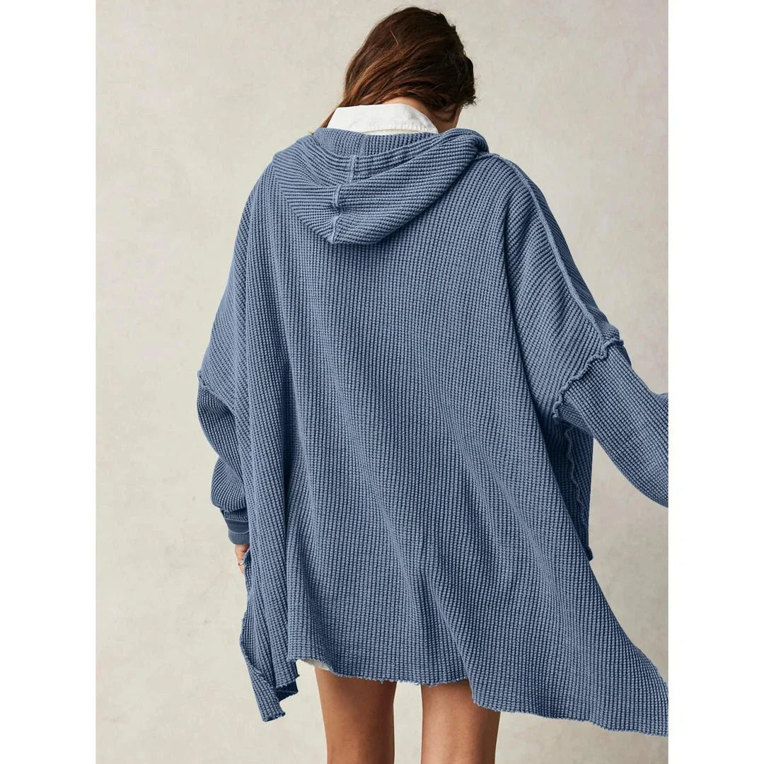 Cosy and stylish oversized hoodie with practical pockets for women, available in black, charcoal grey, and navy blue