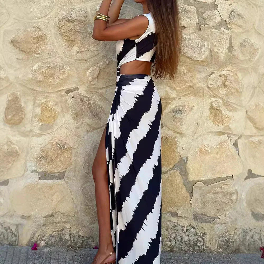 Elegant white V-neck sleeveless lace dress with stylish split, perfect for formal events or casual outings.