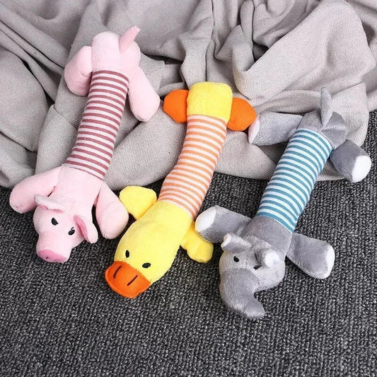 Premium plush squeaky dog toy in various colours, featuring textured stripes for dental cleaning and a built-in sound generator for interactive play.