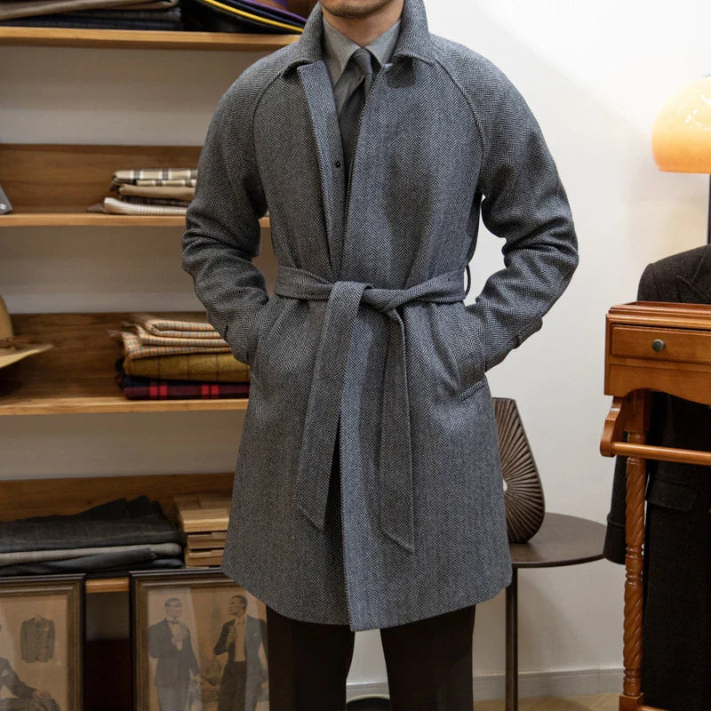 Premium mid-length herringbone wool coat in a sophisticated dark grey hue, featuring a tailored slim-fit silhouette for a refined, stylish appearance.