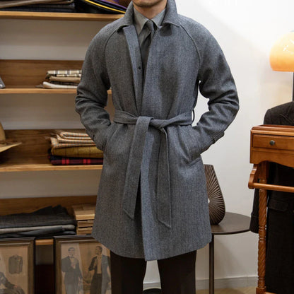 Premium mid-length herringbone wool coat in a sophisticated dark grey hue, featuring a tailored slim-fit silhouette for a refined, stylish appearance.