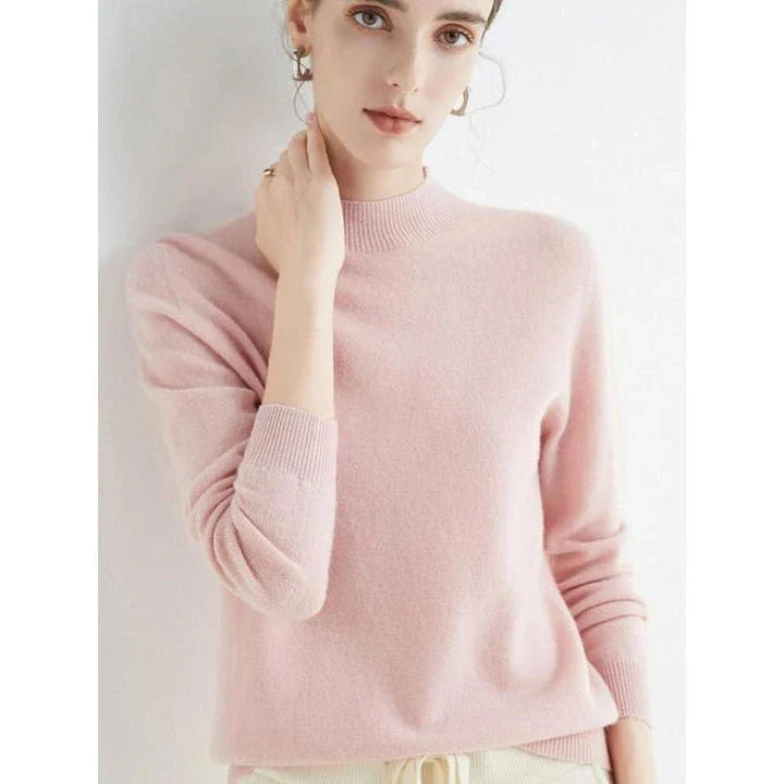 A woman wearing a luxurious Merino wool mock-neck jumper in a stylish autumnal outfit