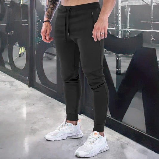 Premium athleisure trousers for stylish British men, featuring a refined sports-inspired design, breathable cotton construction, and a sleek, slim-fit silhouette.