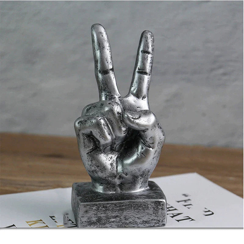 Elegant resin gesture ornaments in a variety of classic bronze and silver finishes, perfect for adding a charming accent to British-inspired home decor