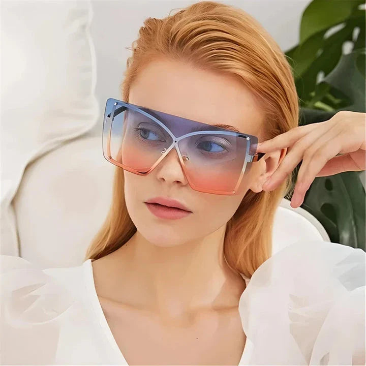 Fashionable oversized flat top sunglasses with gradient lenses and a sleek, rimless plastic frame