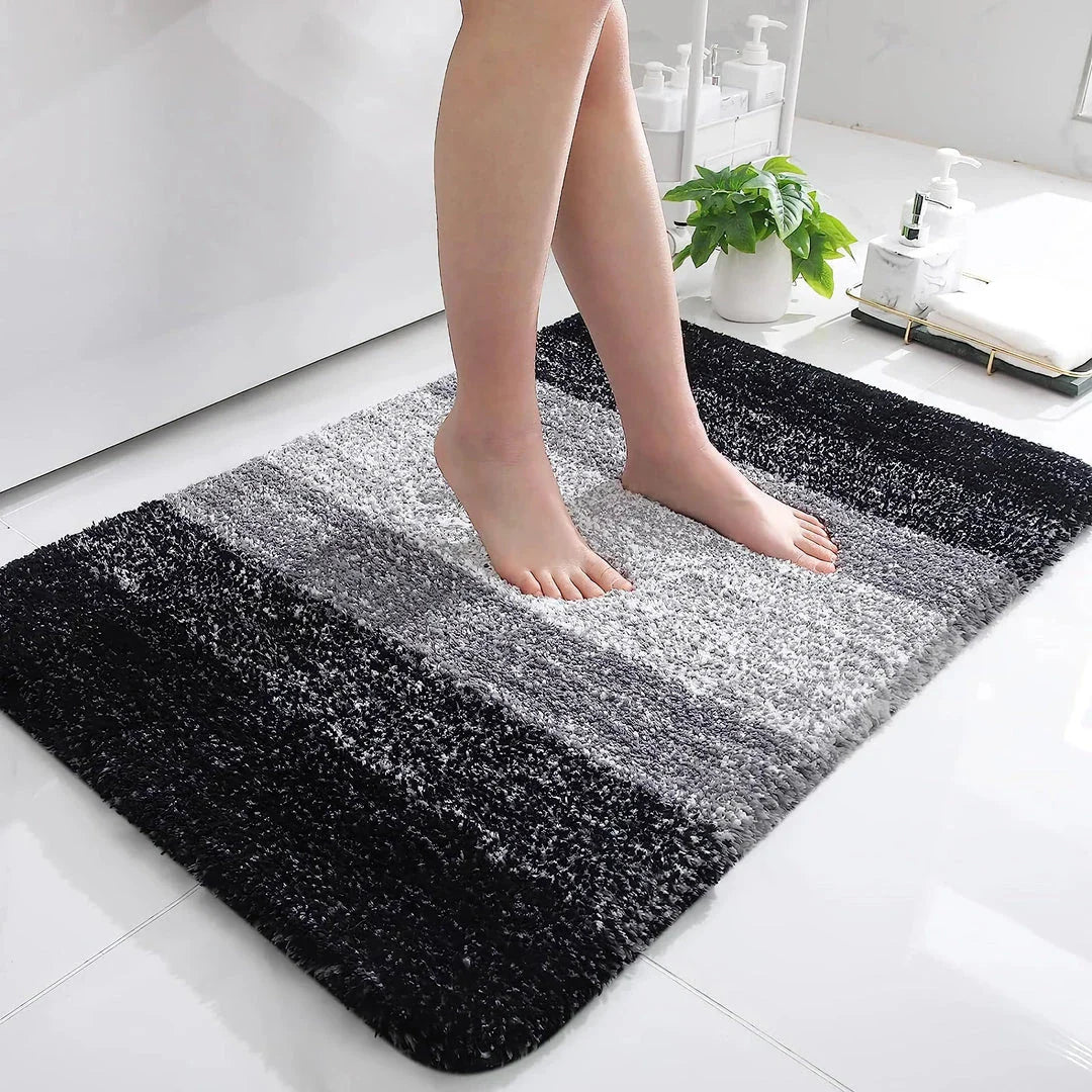 Luxurious microfibre absorbent bath mat in grey, featuring soft coral velvet surface and high-density memory foam cushioning