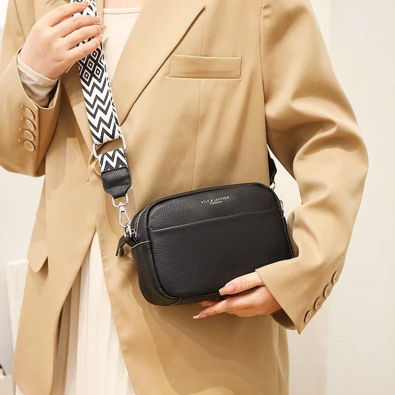Stylish leather crossbody bag with embroidered strap in various colours