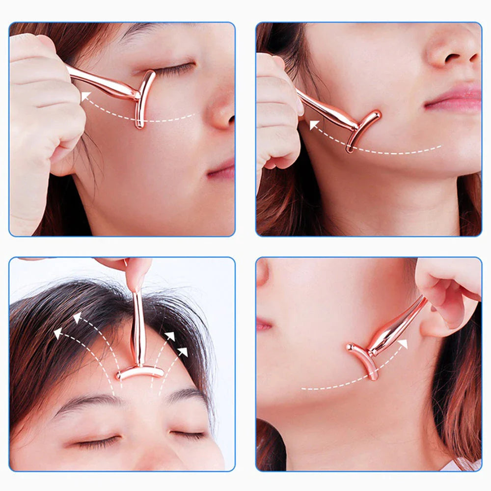 A rose gold metal eye cream applicator and face massager tool with a Y-shaped design for effective skincare application and facial massage