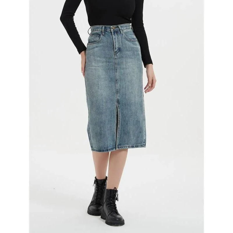 A high-waist denim pencil skirt with a classic A-line silhouette, perfect for the modern British woman.