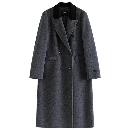 A sophisticated and stylish dark grey woollen coat for women, designed with a timeless double-breasted closure and notched collar.