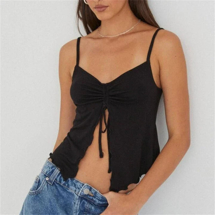 Chic white sleeveless crop top with side bandage detail, perfect for summer fashion