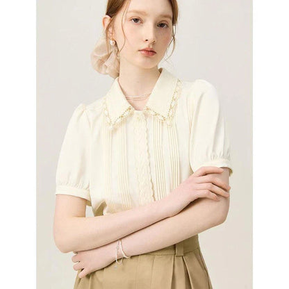Elegant embroidered polo-neck blouse with petal sleeves, perfect for British summer fashion