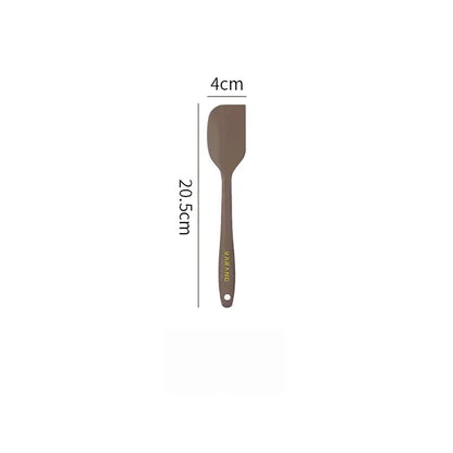 A set of two high-quality silicone spatulas in brown and yellow colours, designed for versatile cooking and baking tasks.