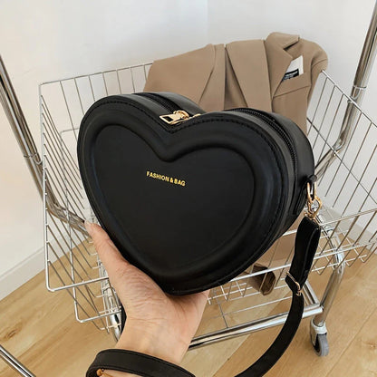 Chic heart-shaped crossbody bag made from premium PU leather, available in multiple stylish colours