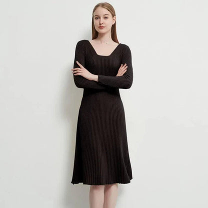 Elegant and cosy midi sweater dress in black, featuring a solid, body-hugging silhouette and comfortable knit fabric