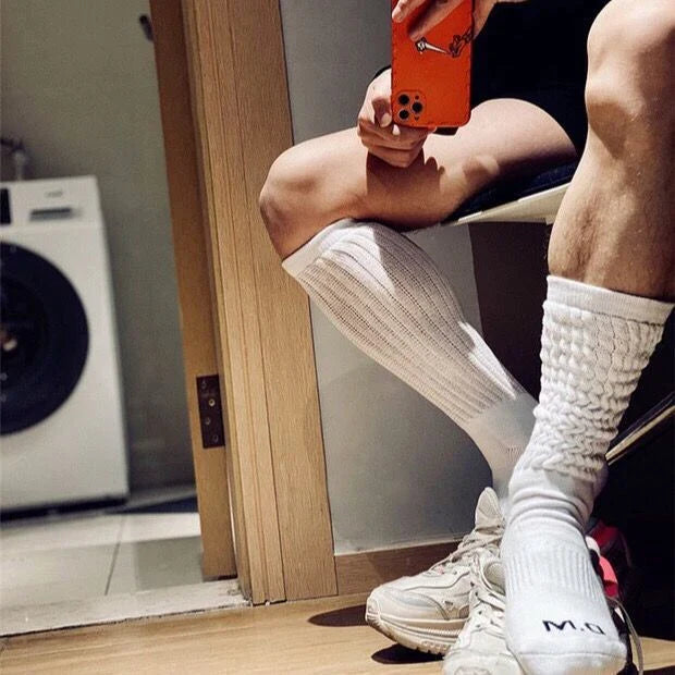 Premium men's breathable terry socks in various solid colours, offering superior moisture-wicking and comfort